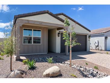 Charming single-story home featuring desert landscaping, neutral paint scheme, and a two-car garage at 18141 W Hiddenview Dr, Goodyear, AZ 85338