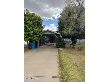 Charming single story home with covered parking and mature trees at 2141 W Elm St, Phoenix, AZ 85015