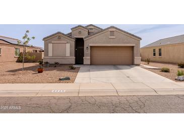Charming single-story home featuring a well-maintained yard and a two-car garage at 2220 N St Bonita Ln, Casa Grande, AZ 85122