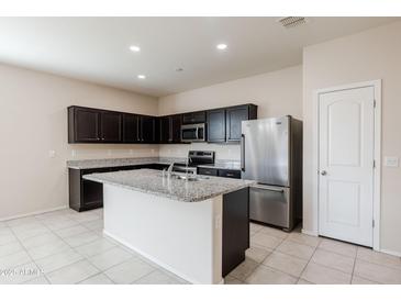 Modern kitchen with stainless steel appliances and an island at 2220 N St Bonita Ln, Casa Grande, AZ 85122