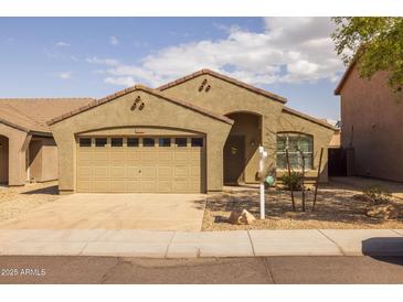 Charming single-story home featuring a two-car garage and low-maintenance desert landscaping at 3122 W Dunbar Dr, Phoenix, AZ 85041