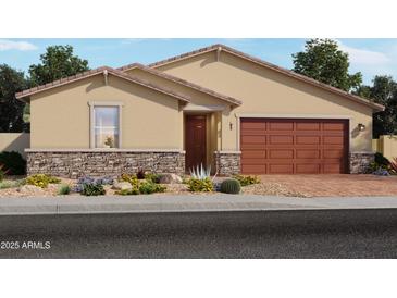 Charming single-story home with a two-car garage and a well-maintained desert front yard with low stone accents at 4777 W Hunter Trl, San Tan Valley, AZ 85144