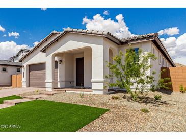 Beautiful single-story home with a neutral color palette and manicured landscaping at 7342 W Hedge Hog Pl, Peoria, AZ 85383