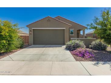 Charming single-story home with a two-car garage, desert landscaping, and a welcoming facade at 3597 E Appaloosa Dr, San Tan Valley, AZ 85140