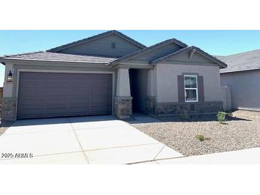 Charming single-story home featuring a two-car garage and neutral paint scheme at 36939 W Santa Maria St, Maricopa, AZ 85138