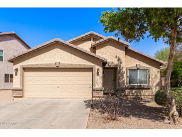 Charming single-Gathering home featuring a two-car garage and low-maintenance landscaping at 4076 E Silverbell Rd, San Tan Valley, AZ 85143