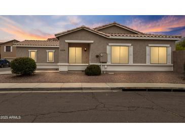 Charming single-story home featuring a neutral stucco exterior, tiled roof, and tidy landscaping at 6228 S Nash Way, Chandler, AZ 85249