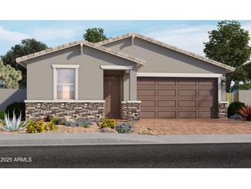 Inviting single-story home featuring a two-car garage and charming desert landscaping at 4166 W Lisa Ln, San Tan Valley, AZ 85144