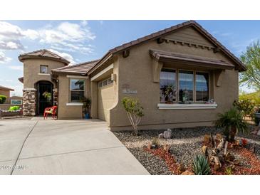 Charming single-story home with well-manicured landscaping and a welcoming front entrance at 11571 E Chevelon Trl, Gold Canyon, AZ 85118
