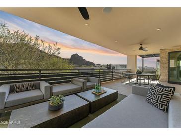 Spacious covered patio boasts comfortable seating and mountain views perfect for outdoor relaxation at 5527 E Arroyo Verde Dr, Paradise Valley, AZ 85253