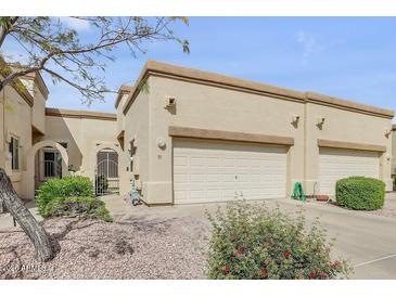 Charming single-story home featuring a two-car garage and desert landscaping at 6730 E Hermosa Vista Dr # 38, Mesa, AZ 85215