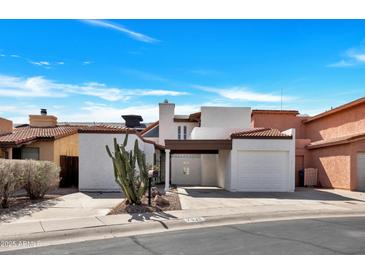Inviting home featuring desert landscaping, a covered carport, and a single-car garage at 7826 N 21St Ln, Phoenix, AZ 85021