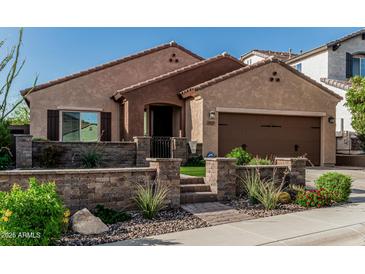 Charming single-story home featuring desert landscaping, a private courtyard, and an attached two-car garage at 1322 W Spur Dr, Phoenix, AZ 85085