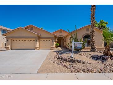 Charming single-story home featuring a well-manicured desert landscape and a spacious three-car garage at 2620 W Piedmont Rd, Phoenix, AZ 85041