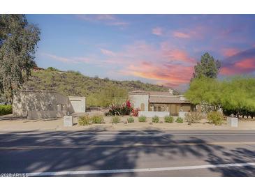 Charming single-story home with mature desert landscaping and mountain views at 14814 N Coral Gables Dr, Phoenix, AZ 85023
