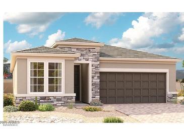 Beautiful single-story home with stone accents and a two-car garage, surrounded by desert landscaping at 17647 W Bajada Rd, Surprise, AZ 85387