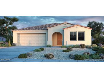 Charming single-story home with stucco siding, tile roof, desert landscaping, and a two-car garage at 5421 W Jackalope Ln, Laveen, AZ 85339