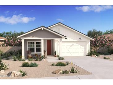Charming single-story home with desert landscaping, covered porch, and attached two-car garage at 7646 W Park St, Laveen, AZ 85339