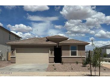 Charming single-Gathering home with a two-car garage and desert landscaping at 17016 W Cavedale Dr, Surprise, AZ 85387