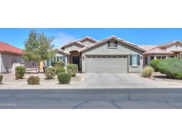 Charming single-story home with a well-manicured lawn and inviting curb appeal at 2384 E Santiago Trl, Casa Grande, AZ 85194