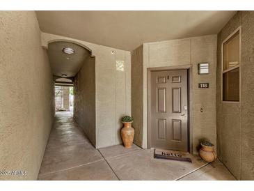 Neutral front door with unit number on the right, and welcome mat at 5303 N 7Th St # 118, Phoenix, AZ 85014