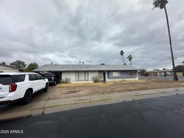 Quaint single-story home featuring classic architecture and a muted color palette at 14839 N 29Th Dr, Phoenix, AZ 85053