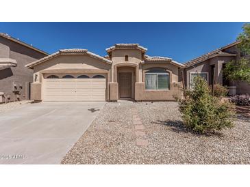 Charming single-story home with a well-maintained front yard and desert landscaping at 2794 E Cowboy Cove Trl, San Tan Valley, AZ 85143