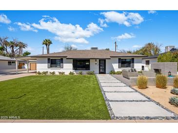 Charming single story home with meticulously landscaped front yard and walkway, perfect for a Gathering at 3630 N 39Th St, Phoenix, AZ 85018