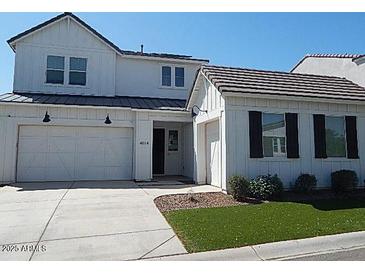Charming two-story home featuring a two-car garage and modern farmhouse details at 4514 N 198Th Ln, Litchfield Park, AZ 85340