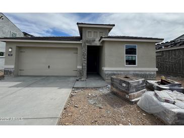 New single-story home features a two-car garage, neutral stucco, and a covered porch area at 7425 W Buckhorn Trl, Peoria, AZ 85383
