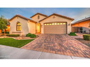 Beautiful single story home with neutral stucco, decorative tile roof and a paver driveway and walkway at 269 E Horseshoe Dr, Chandler, AZ 85249