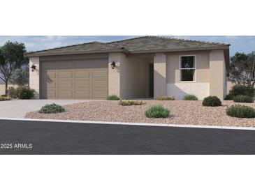 Charming single story home with neutral stucco, rock landscaping, and a two-car garage at 9540 W Parkway Dr, Tolleson, AZ 85353
