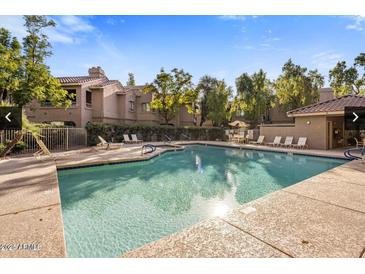 Enjoy this beautiful pool with lounge seating and desert landscaping in this well-maintained community at 15252 N 100Th St # 1154, Scottsdale, AZ 85260