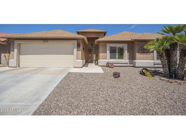 Charming single-story home featuring a low-maintenance desert landscape, attached garage, and inviting front entrance at 1562 E Gleneagle Dr, Chandler, AZ 85249