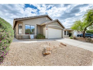 Charming single-story home with a two-car garage and low-maintenance desert landscaping at 20419 N 34Th St, Phoenix, AZ 85050
