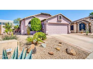 Charming single-Gathering home with a well-maintained front yard and a two-car garage at 21605 N 48Th Pl, Phoenix, AZ 85054