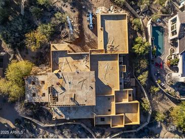 Expansive new home under construction boasts a spacious layout, and beautiful desert surroundings at 29121 N 105Th St, Scottsdale, AZ 85262