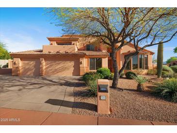 Charming two-story home featuring a three-car garage and mature desert landscaping at 4055 N Recker Rd # 71, Mesa, AZ 85215