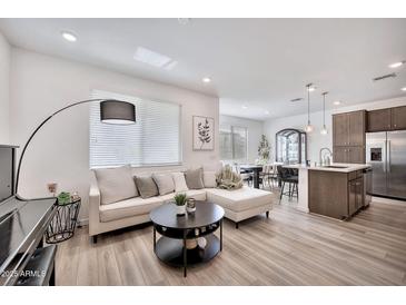 Bright living room features a comfortable couch and modern decor at 4803 S Ferric --, Mesa, AZ 85212