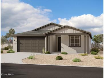 Charming single-story home featuring neutral tones and low-maintenance landscaping at 5638 W Olney Ave, Laveen, AZ 85339