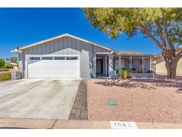 Charming single-story home featuring a two-car garage and covered front porch in a well-maintained community at 1060 S Florence Dr, Mesa, AZ 85208