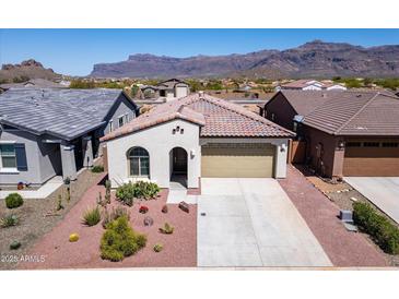 Charming single-story home featuring a desert landscaped yard and a two-car garage at 12538 E Pivot Peak --, Gold Canyon, AZ 85118