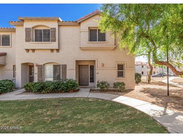 Charming home featuring a well-maintained lawn and inviting front entrance on a sunny day at 1961 N Hartford St # 1087, Chandler, AZ 85225