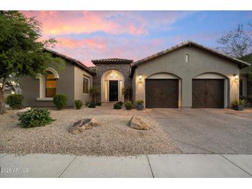 Charming single-Gathering home features an inviting stone accented entryway and a spacious two-car garage at 3841 E Patrick Ln, Phoenix, AZ 85050