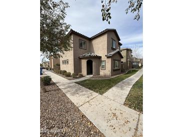 Charming two-story home featuring a covered entrance and well-maintained landscaping at 1734 W Pollack St, Phoenix, AZ 85041