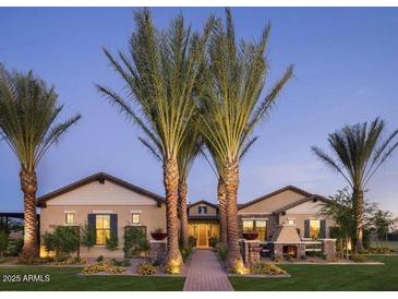 Charming single-story home with desert landscaping, stone accents, and covered front porch at 17673 E Bronco Dr, Queen Creek, AZ 85142