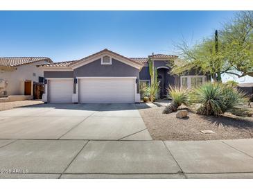 Charming single-story home with a three-car garage and drought-tolerant landscaping at 29023 N 48Th Ct, Cave Creek, AZ 85331
