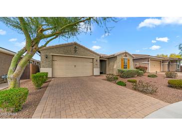 Charming home featuring a desert landscape, paver driveway and a two car garage at 31318 N 26Th Dr, Phoenix, AZ 85085