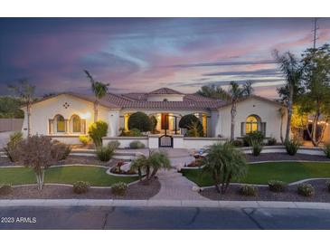 Stunning single-story home with lush landscaping, paver walkway, and barrel tile roof at 4547 S Banning Dr, Gilbert, AZ 85297