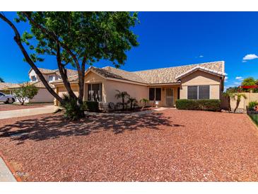 Charming single-story home featuring a low-maintenance desert landscape and a private front entry at 3140 N 114Th Dr, Avondale, AZ 85392